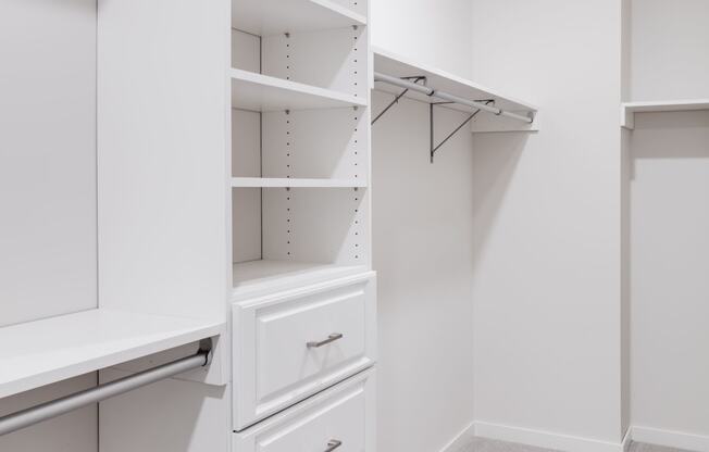a spacious closet with white walls and drawers at Maven on Broadway, Minnesota, 55904