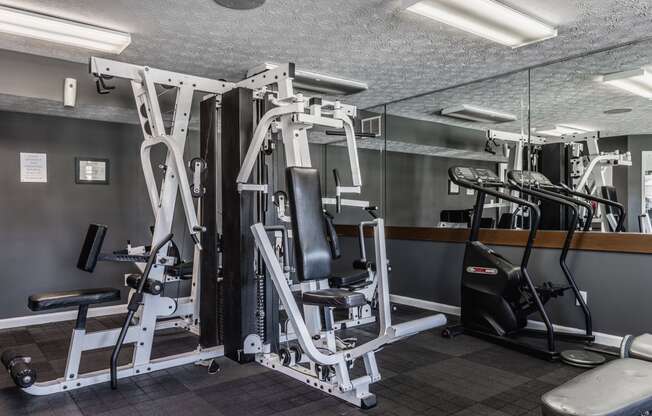 a gym with various exercise equipment