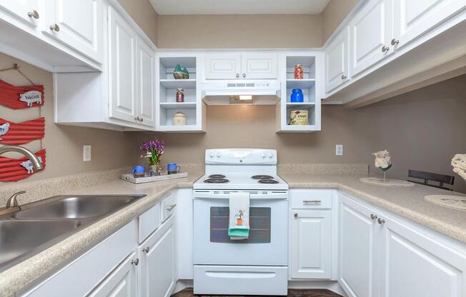 a kitchen with a sink and a microwave