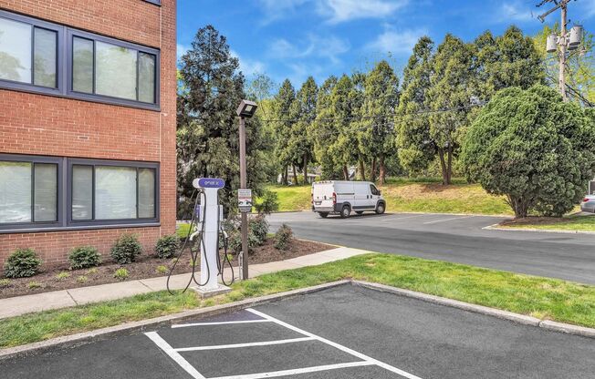 a white van parked in a parking lot next to a building