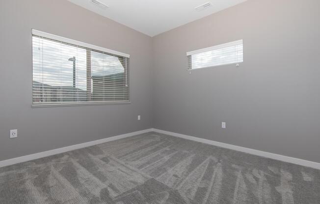 a bedroom with a large window