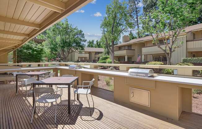 a rendering of a balcony with trees and benches at Summerwood Apartments, Santa Clara, CA 95050