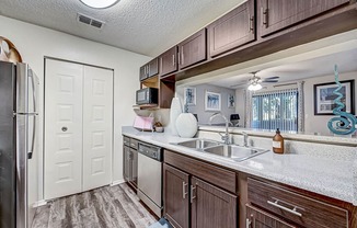 our apartments have a modern kitchen with stainless steel appliances at St. Johns Forest Apartments, Florida, 32277