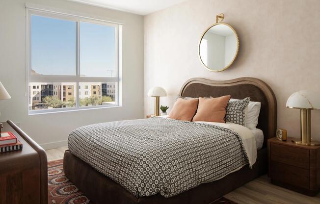 A serene bedroom retreat with warm textures, designer lighting, and natural light pouring in from expansive windows.