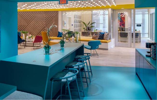 A brightly lit room with a bar and seating area.