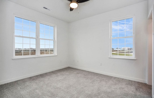 Bedroom with Large Windows at Meadowbrooke Apartment Homes in Kentwood, MI 49512