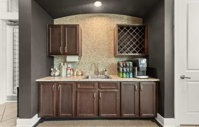 a rendering of a kitchen with brown cabinets and a counter