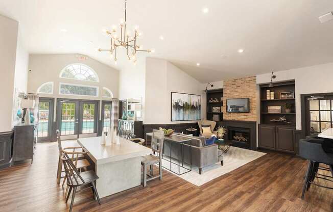 A modern open concept living room with a dining area and kitchen.