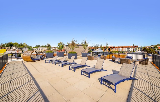 a row of lounge chairs on a roof top patio at The Hayes on Stone Way, Seattle, Washington