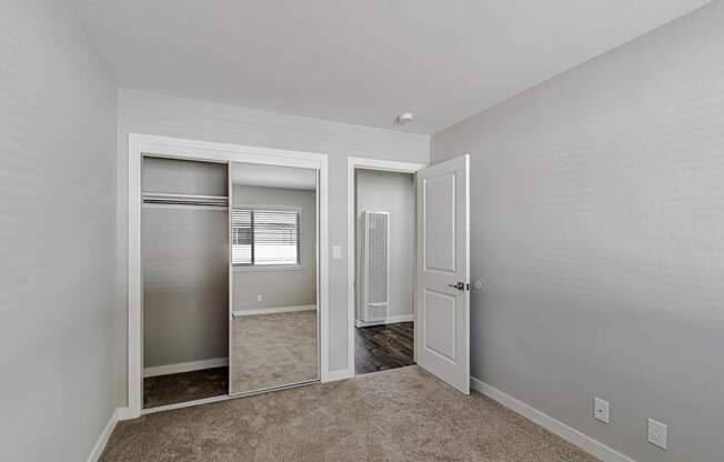 A white door is open to a hallway.