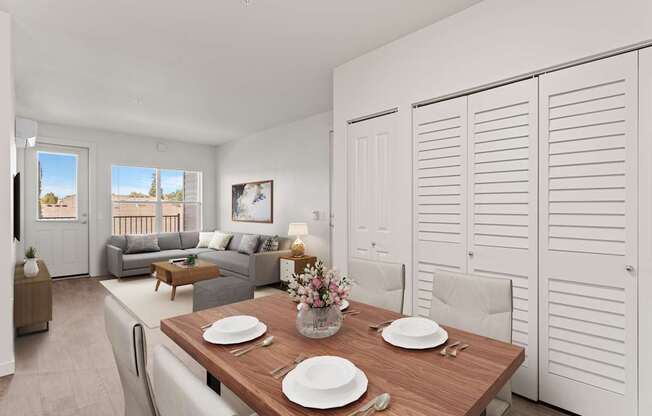 A dining room with a table set for two.