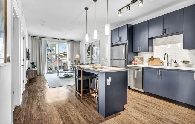 Navy blue kitchen style with stainless steel appliances