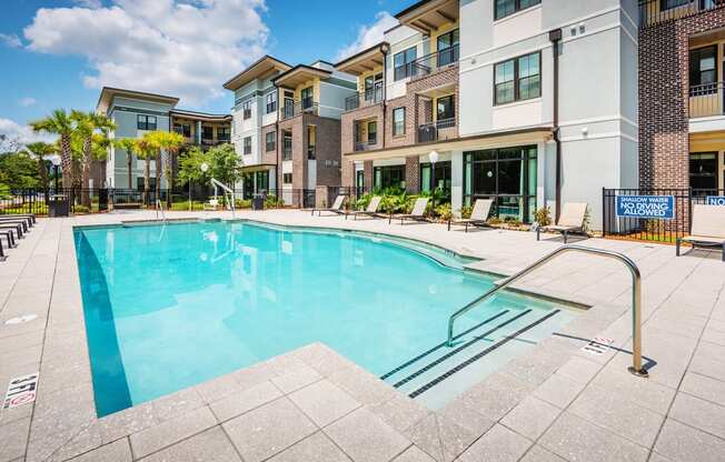 Centre Pointe Apartments resort-style pool area with surrounding sundeck