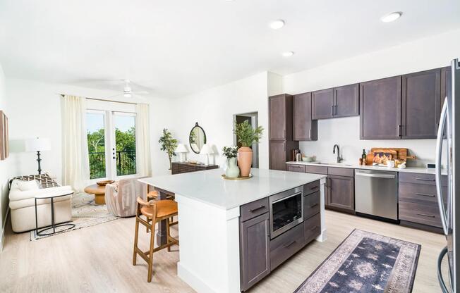 Sleek kitchens at Modera Trailhead feature spacious islands, designer finishes, and open layouts that flow seamlessly into bright living areas.