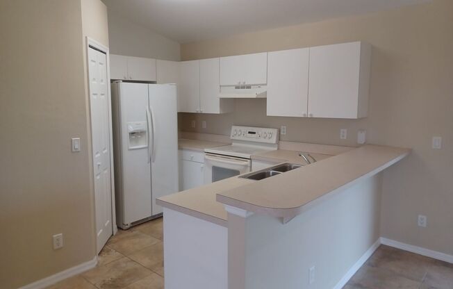 PRICE REDUCTION: Freshly Painted: 3 bedroom 2 bathroom single family home with screened lanai