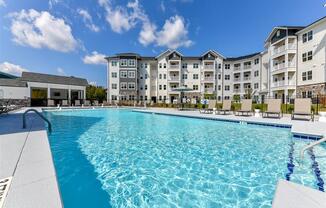 Outdoor resort-style saltwater swimming pool at The Station at Brighton apartments for rent in Grovetown, GA