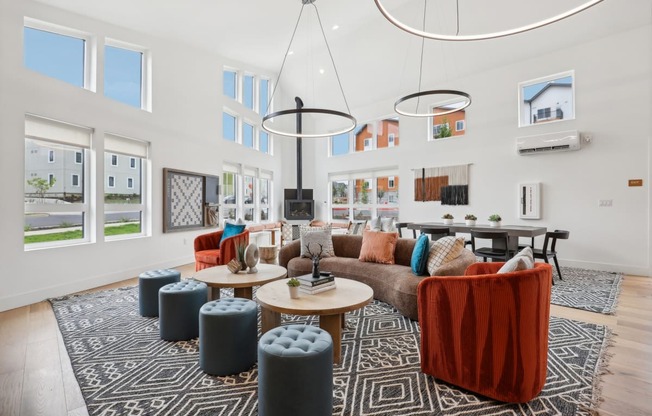 a living room with couches and chairs and a table