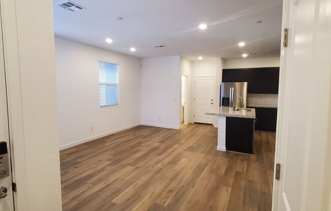 Contemporary townhome with modern exterior and attached garage.