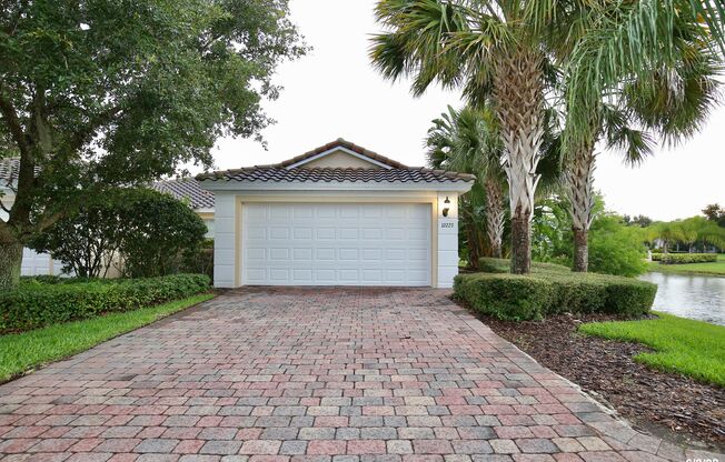 Beautiful 3/2 Corner Duplex with Water View in Highly Sought After Gated Community of Village Walk - Lake Nona!