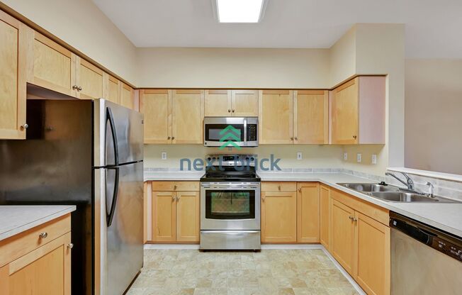 Rare Ground-Floor, End Unit with massive bonus office and Private 2-Car Garage!