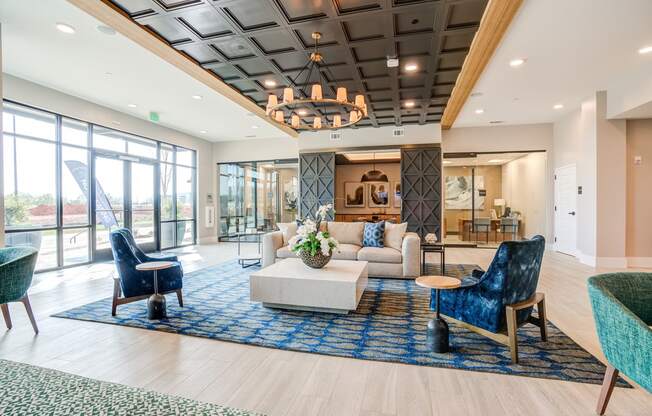 a resident clubhouse with couches chairs and a coffee table