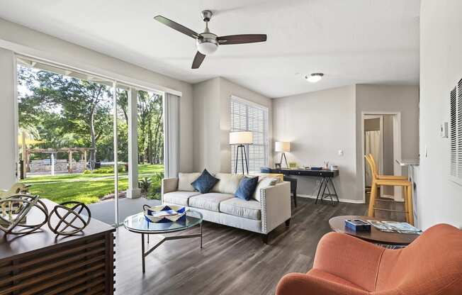 Spacious Living Room with Grey Hardwood Style Flooring