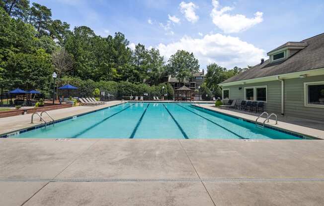 the swimming pool at our apartments with trees in the background