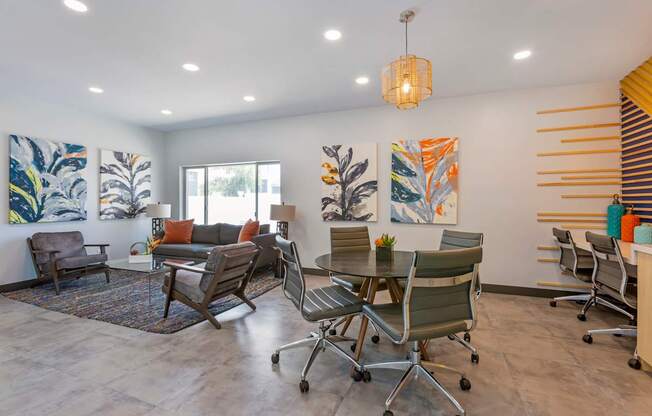 A modern office space with a grey floor and white walls.