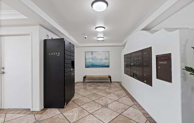 a hallway with a locker and a painting on the wall at Dronfield Astoria, 13140 Dronfield Ave, California