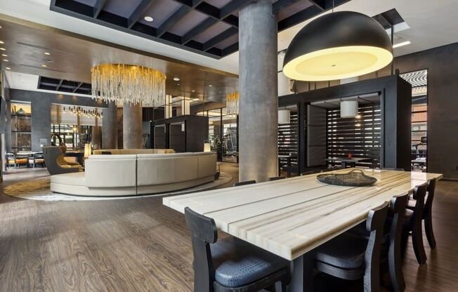 a dining room with a table and chairs in front of a wine cellar