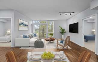 a living room with a couch and a table and a tv