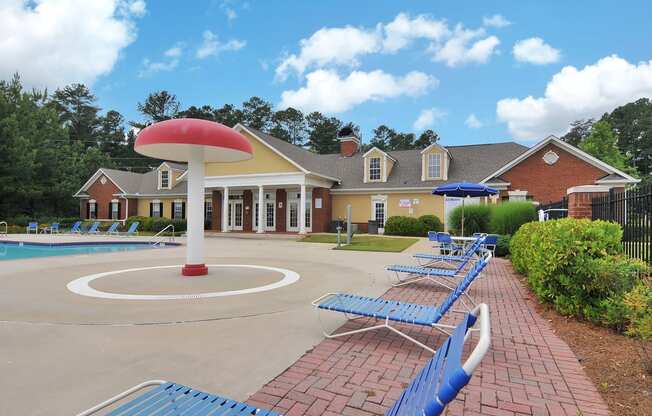 Swimming pool with lounge chairs, tanning deck.
