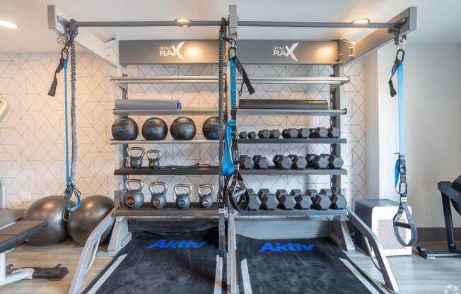 Free Weights In Gym at Latitude at South Portland Apartment, Maine, 04106