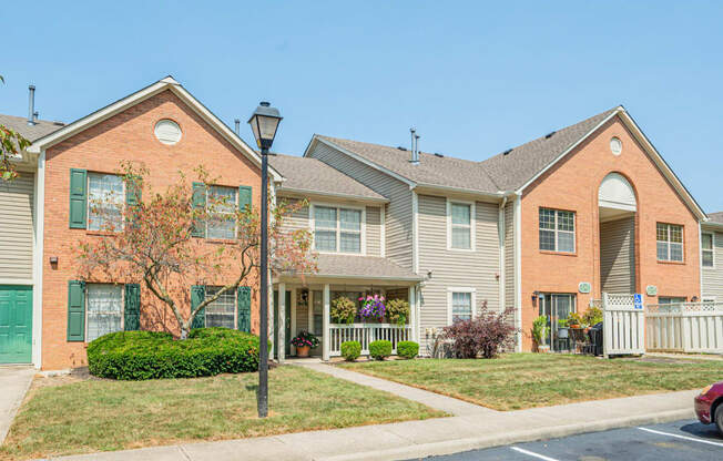 a row of houses with a sidewalk in front of them