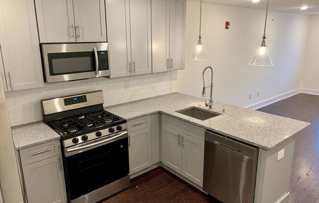 Stunning 2-Bed Condo with Private Roof Deck in Norris Square! Available mid-July!