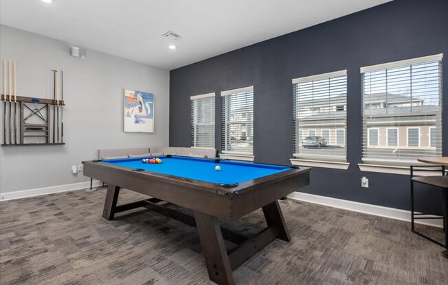 a games room with a pool table
