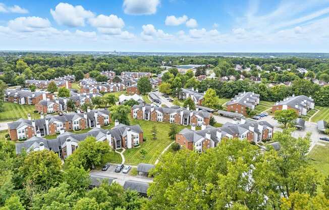 A bird's eye view of a residential area with houses and trees.