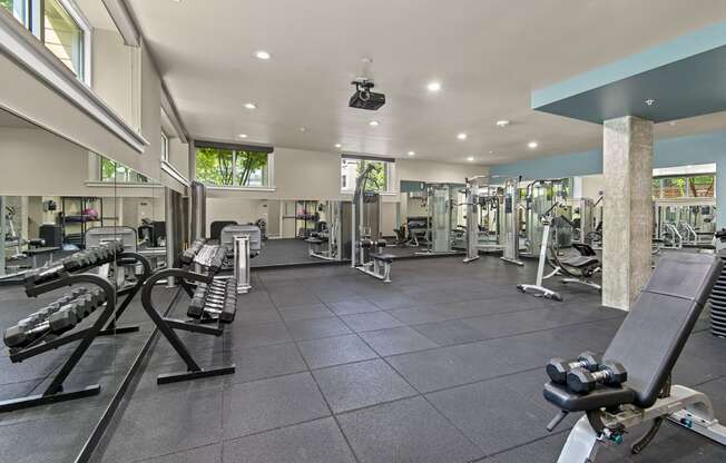 a spacious fitness center with treadmills and other exercise equipment