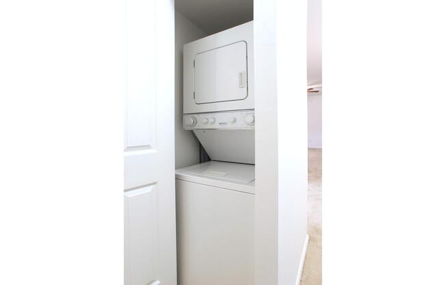 a white refrigerator freezer sitting in a room