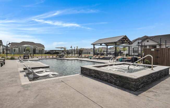 Resort-style pool, spa, and lounging at Avilla Oakridge in Forney, TX.