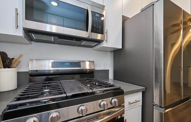 a stove top oven sitting inside of a kitchen