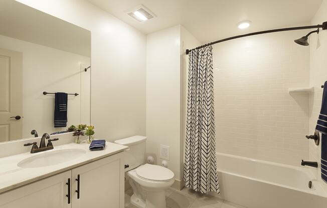 a bathroom with a sink toilet and a shower