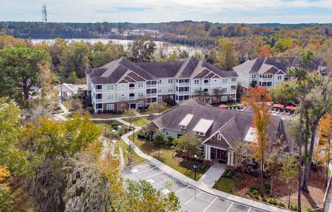 an aerial view of a building surrounded by trees