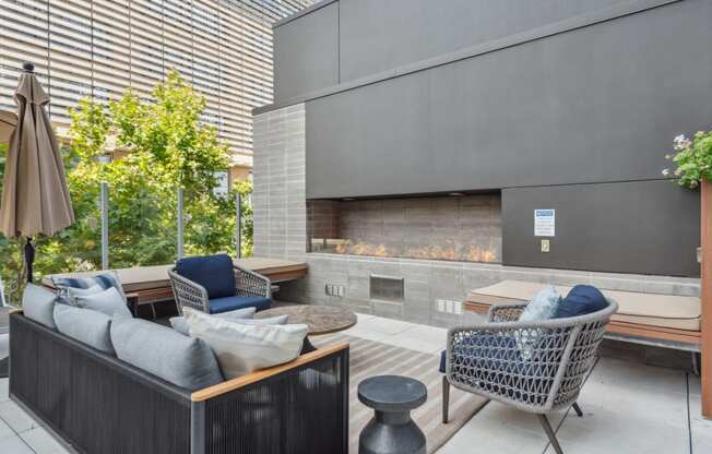 a living room with couches and chairs and a fireplace