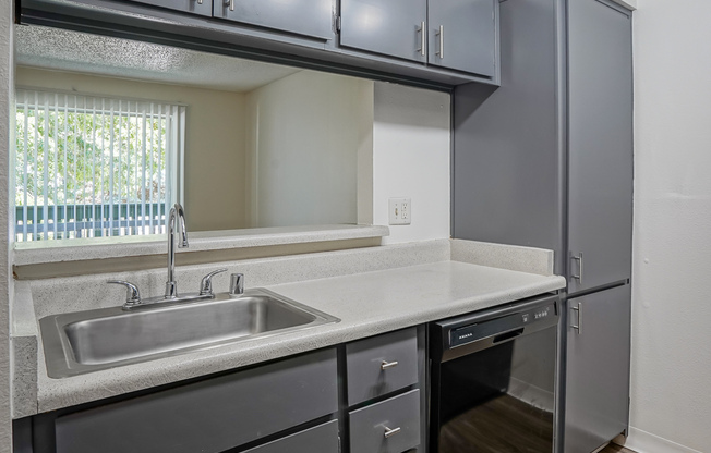 View of kitchen bar from inside kitchen at Treehouse Apartments in Albuquerque, New Mexico