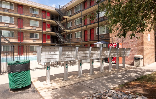 a bench in front of an apartment building