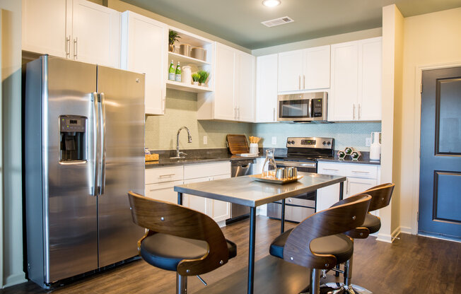 The Cleo Kitchen With Stainless Steel Appliances, and Modern White Wood Cabinets