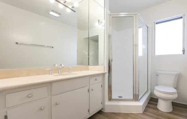 Bathroom with White Cabinets and Shower