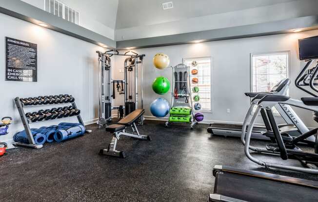 fitness room with weights and other exercise equipment at The links at Plum Creek Apartments, Colorado, 80104