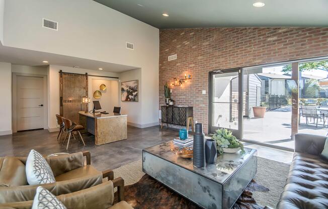 a living room filled with furniture and a large window